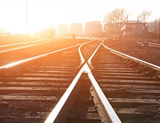 A sunrise over railroad tracks