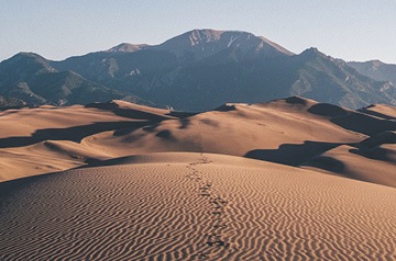 footprints in sand dunes