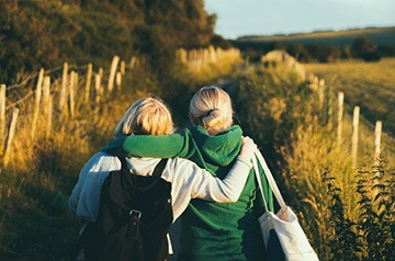 friends walking through fields together