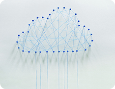 string art of blue cloud on white wall