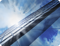 reflection of sky on side of skyscraper