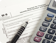 Pen and calculator atop W-9 form