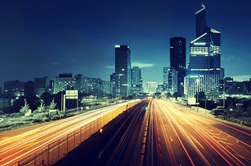 Evening view of cityscape with blurred highway lights