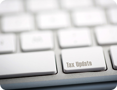 keyboard with a key that reads 'Tax Update'